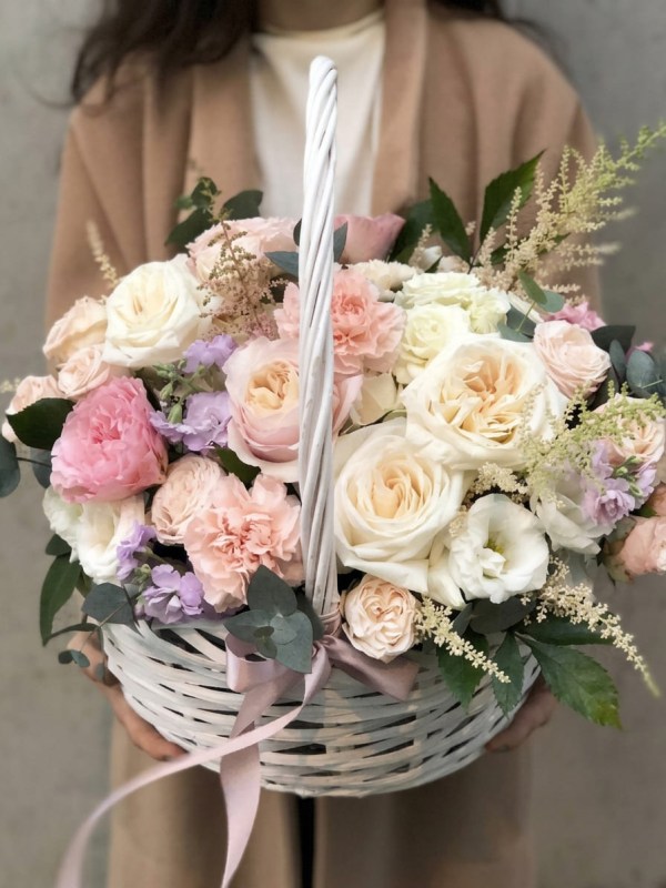 Designer basket in pastel colors with garden roses