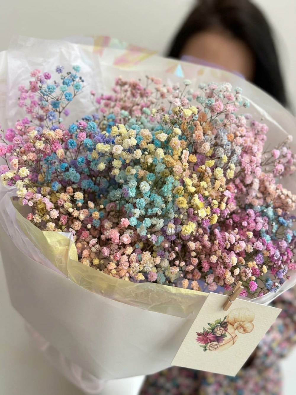 Bouquet of 7 branches of rainbow gypsophila in light wrapping